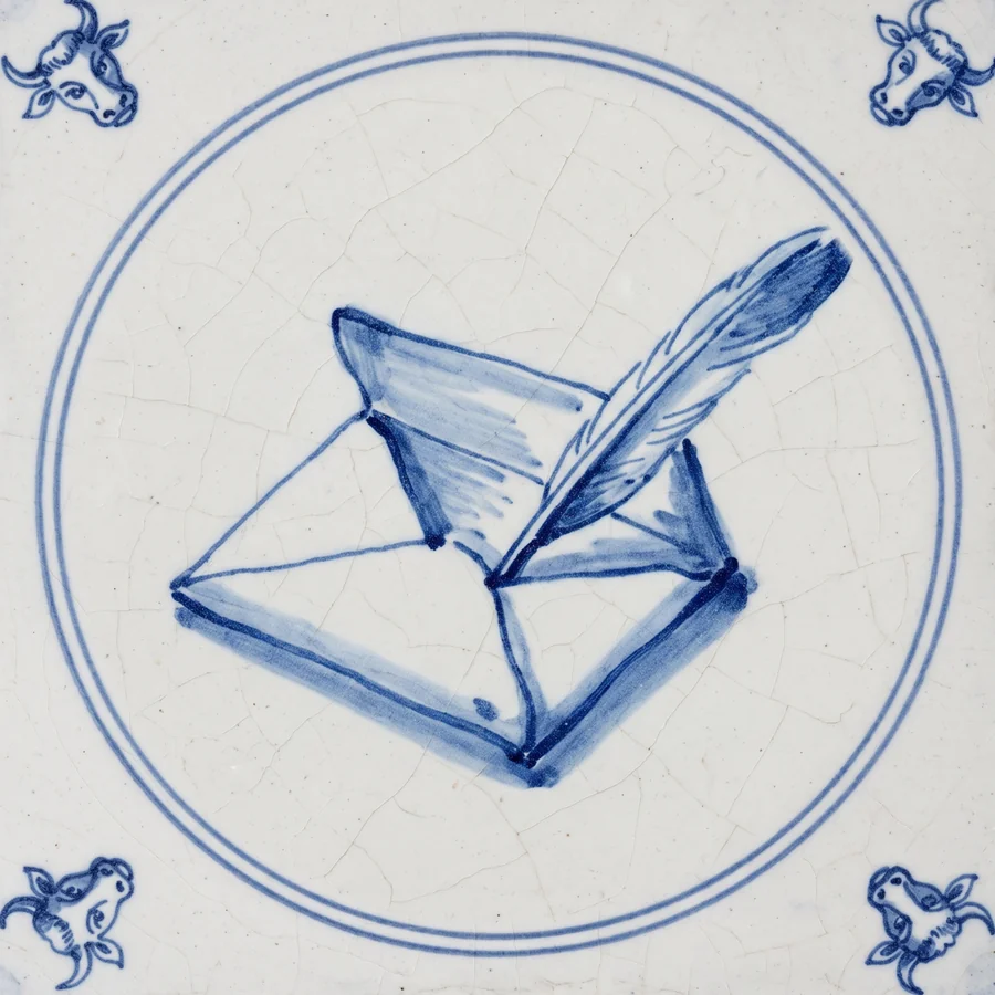 Delft tile painted with an open letter and a quill pen